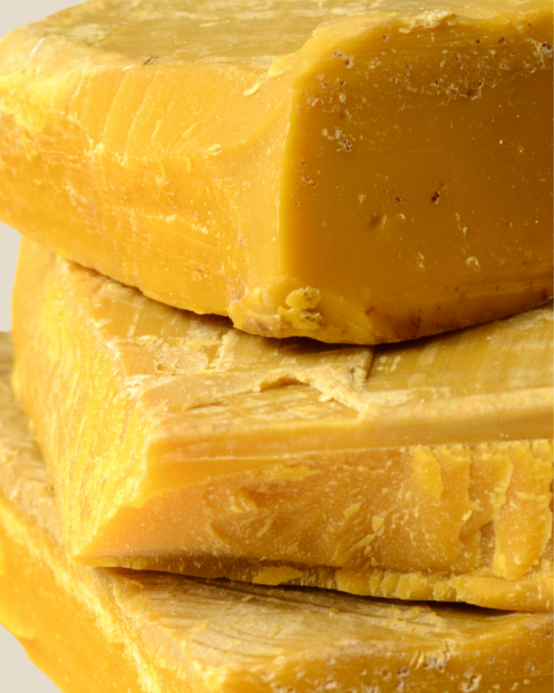 Stack of beeswax cappings on a light background